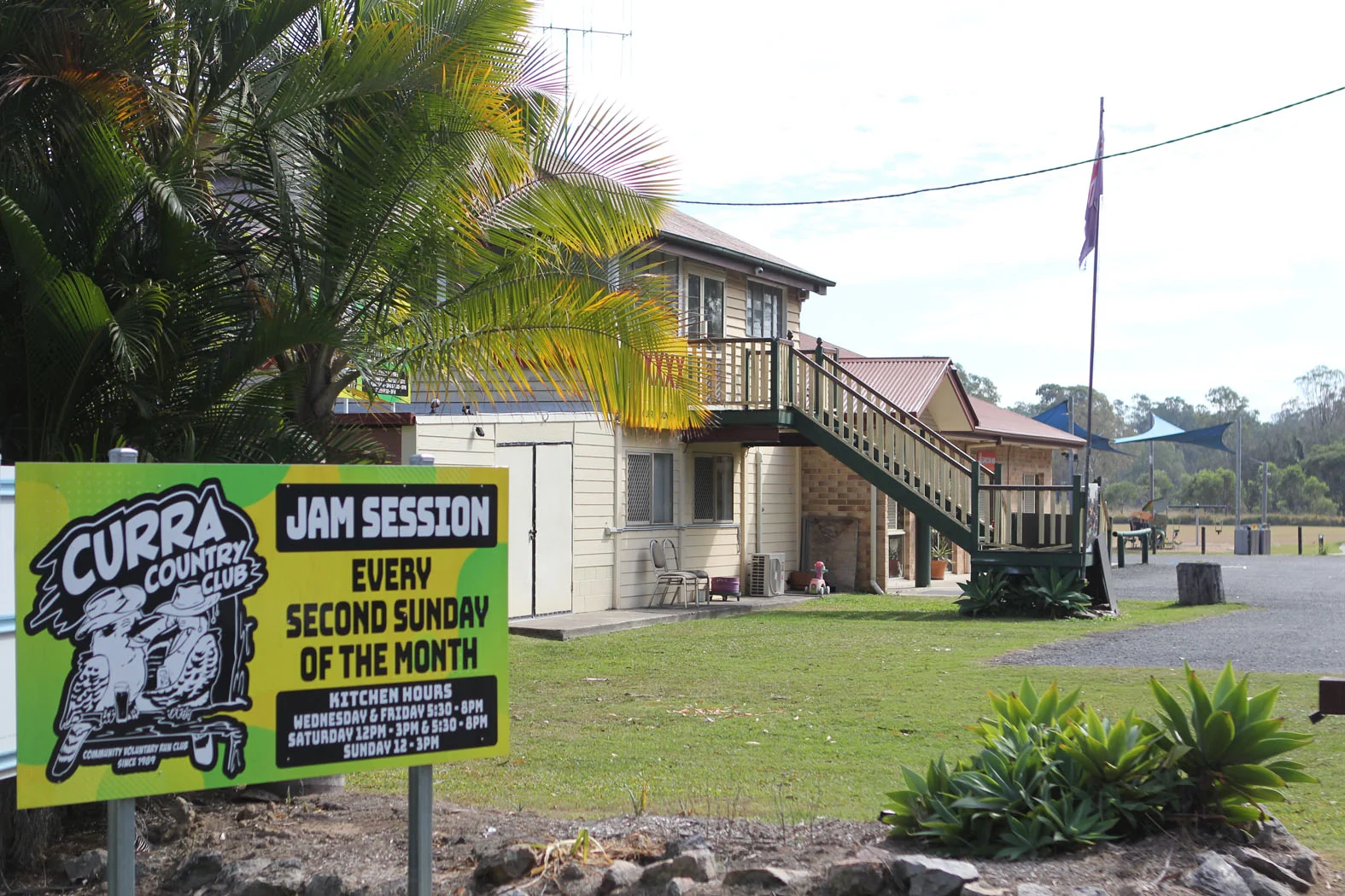 Curra Country Club beside the community hall with a local jam session sign