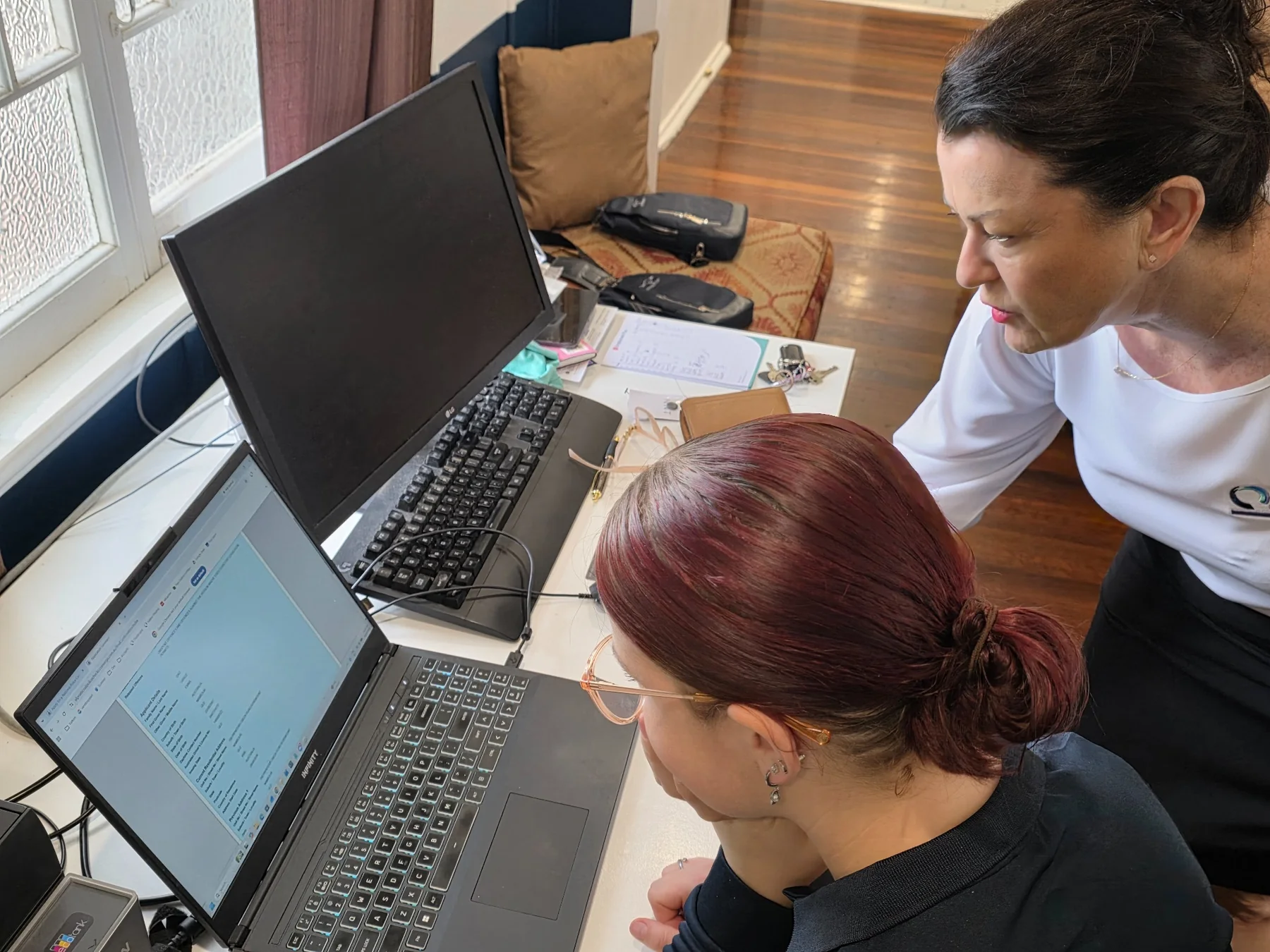 Acclyptic team members reviewing information together